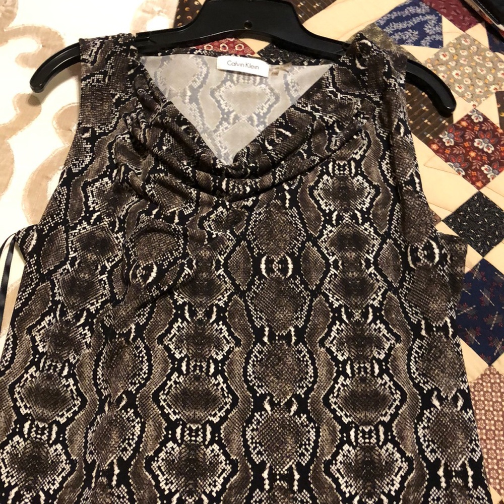 Snake print shell in perfect condition.